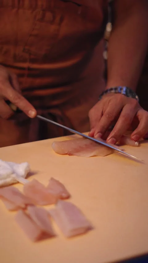 Chef slicing snapper sashimi in asian kitchen counter vertical 4K video Stock Footage 317408549