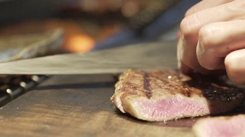 Chef slicing steak Stock Footage 103797380