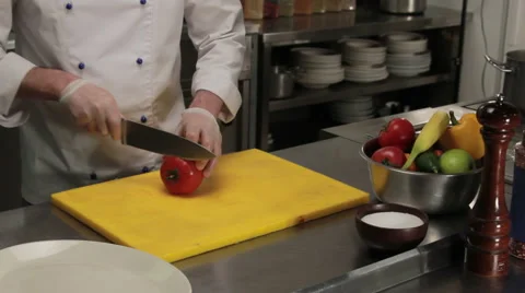 Chef slicing tomato finely, medium shot 库存影片 66074570