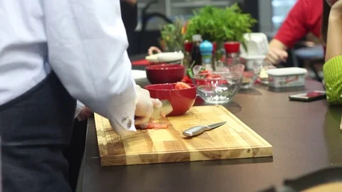 Chef slicing tomatoes Stock Footage 73425548