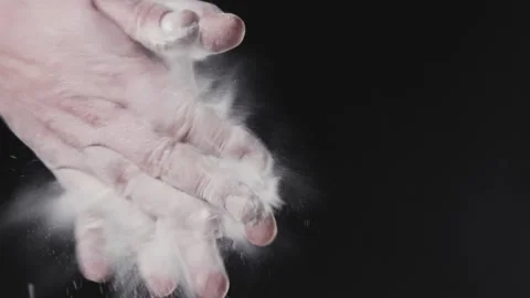 The chef is slowly clapping his hands in flour. Stock Footage 140247152