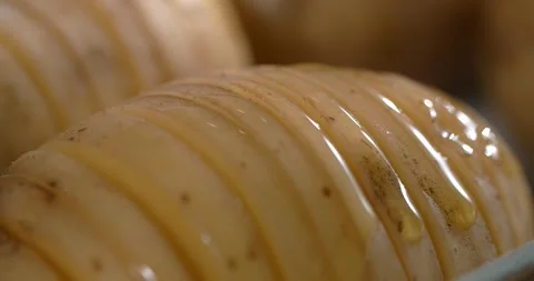 Chef smears raw potato by egg yolk with a brush. Cooking the potatoes, 4k 60p Stock Footage 168572035