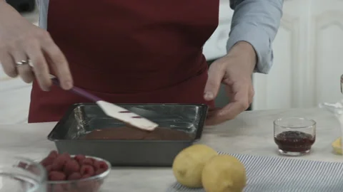 Chef Smoothing Melted Chocolate in Baking Pan Stock Footage 160978056