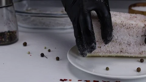 The chef soaks a large piece of pork fat Stock Footage 121784464