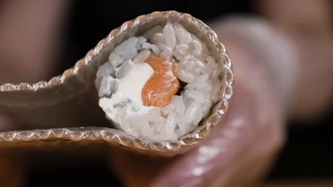 Chef spins roll in a bamboo mat Stock Footage 124211361