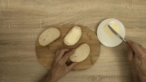 Chef spreading butter on bread slice Stock Footage 122281287