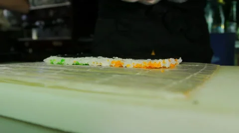 Chef spreading cream cheese over nori Stock Footage 41968096