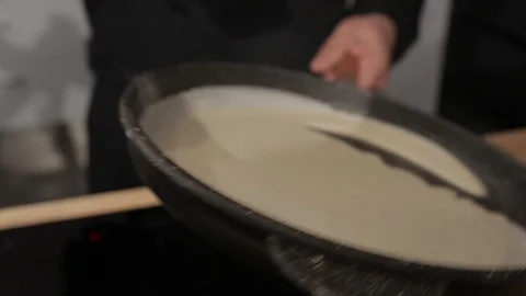 Chef spreading Crepe Batter on a Pan Stock Footage 85855495