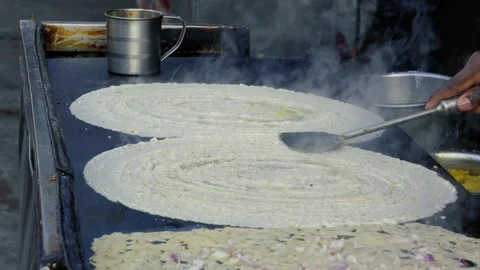 Chef Spreading Dosa Batter on Large Hot Tawa Street Food Cooking Process Stock Footage 331145886