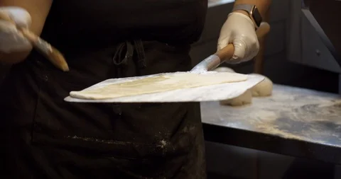 Chef Spreading Olive Oil on Flatbread Video stock 129847705