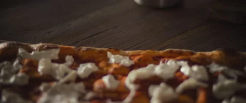 Chef spreading olive oil over a ready burrata al taglio pizza with a brush. Stock Footage 146604425