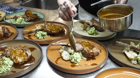 Chef Spreading Sauce on Steak in Fine Dining Kitchen, Slow Motion Shot Stock Footage 245478221