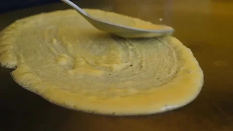 Chef Spreading Sweet Crepe Batter on Hot Griddle Surface Stock Footage 345692583