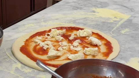 Chef Spreading Tomato Sauce and Adding Toppings to Pizza - Timelapse Stock Footage 339302389