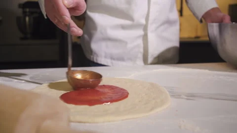 Chef Spreading Tomato Sauce on Pizza. Cooking Pizza in Kitchen Restaurant. 스톡 동영상 169877809