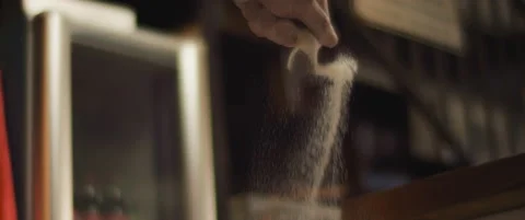 Chef spreading white flour over a pizza dough. Close up, slow motion, shallow Stock Footage 147517996