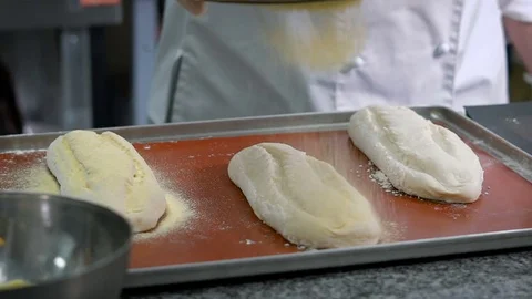 Chef sprinkles buns additional ingredients before you put them to bake. On the Stock Footage 71037162