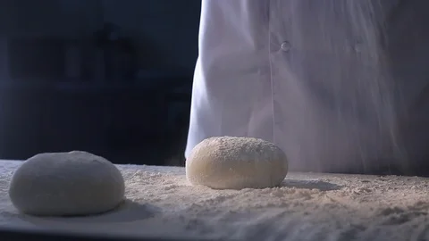Chef sprinkles the cakes with flour Stock Footage 87635812