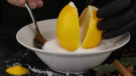The chef sprinkles salt with chopped lemon Stock Footage
