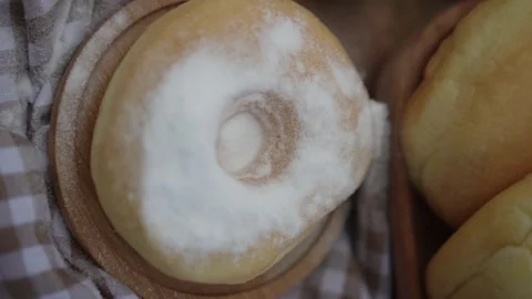 Chef sprinkling and decorating donut with powdered sugar. Stock Footage 280103635