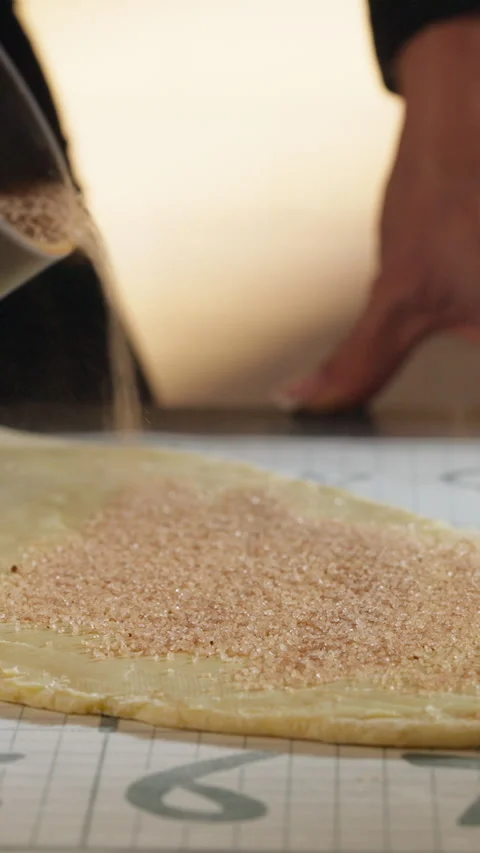 Chef Sprinkling Brown Sugar And Cinnamon On Dough - Cinnamon Rolls. - vertical Video stock 329599043