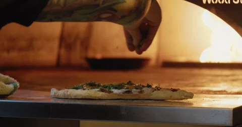 Chef Sprinkling Fresh Herbs on Flatbread Video stock 129846061