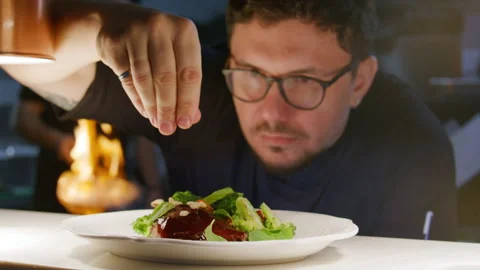 Chef Sprinkling Pine Nuts on Gourmet Dish of Duck and Vegetables Stock Footage 330062788