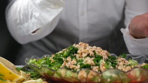 Chef sprinkling salt Stock Footage 237478195