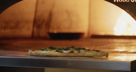 Chef Sprinkling Spices on Flatbread Video stock 129846629