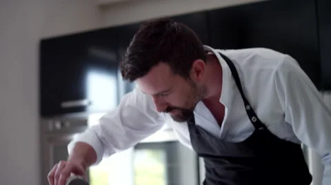 Chef sprinkling sugar at kitchen. Stock Footage 64117559