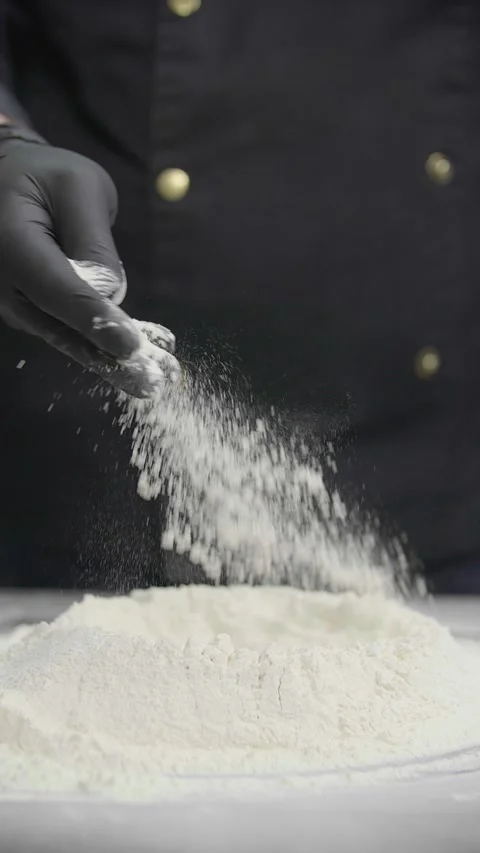 Chef Sprinkling Wheat Flour by Hand for Dough Preparation Видео 341417546