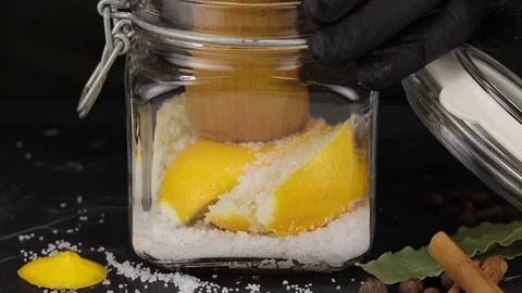 Chef squeezes juice from lemon Stock Footage 123080311