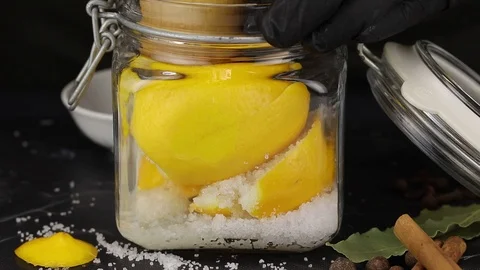 The chef squeezes the juice from two lemons Stock Footage 123080308