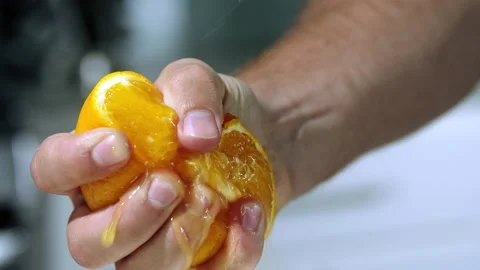 Chef squeezes an orange slow motion Stock-Footage 169459360