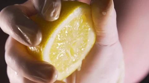 The chef squeezes out the lemon juice Stock Footage 83346397