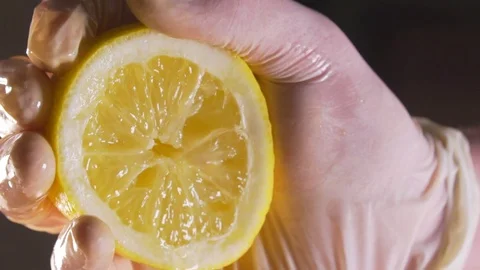 The chef squeezes out the lemon juice Stock Footage 83346414