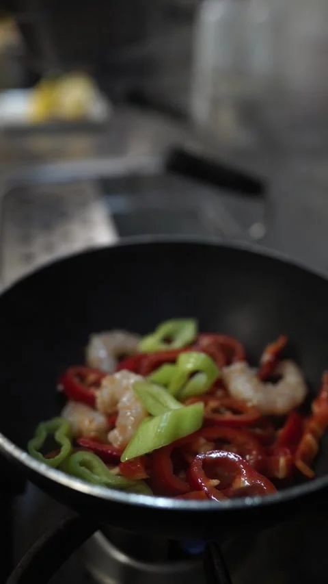 Chef Squeezing Lemon on Sizzling Shrimp in Wok Pan Close-Up Stock Footage 294803829