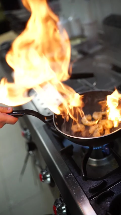 Chef Squeezing Lemon on Sizzling Shrimp in Wok Pan Close-Up Stock Footage 294803946