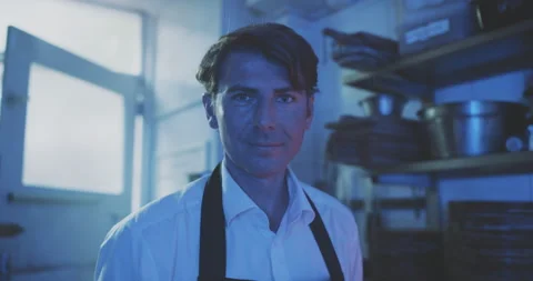 Chef standing in kitchen looking into the camera Stock Footage 203555474