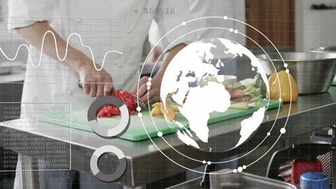 Chef starting chopping red peppers on green board in kitchen, globe and HUD Stock Footage 333575318