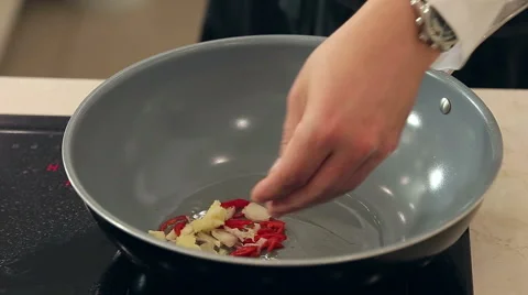 Chef Stewing Garlic, Onion, Ginger and Chili with Soy Sauce in Frying Pan Video stock 53272090