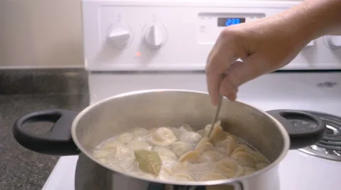 Chef stir dumplings cooking in the pan Stock Footage 63780237