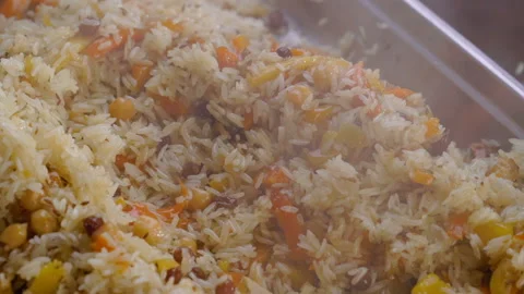 Chef stirring fried rice with vegetables Stock Footage 91087137