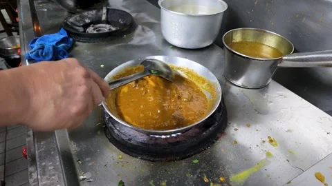 Chef Stirring Indian Curry in Professional Kitchen in Bangkok Stock Footage 344624509