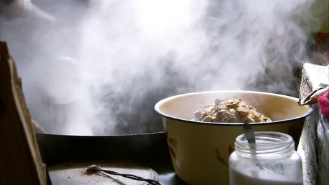 Chef stirring noodle soup with serving spoon in a cooking pot at kitchen Stock Footage 88333177