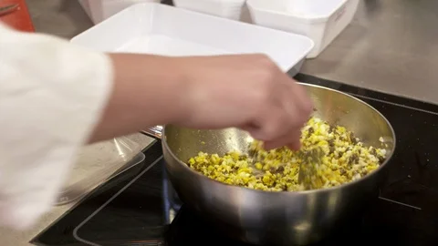 Chef is stirring in pan Stockbeeldmateriaal 92059040