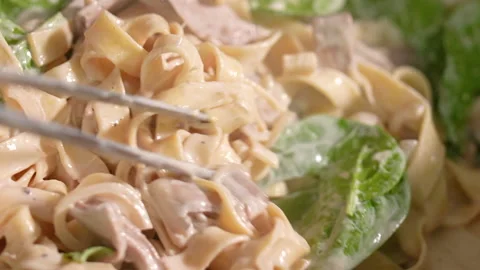 Chef stirring pasta with truffle, basil Stock Footage 221850903