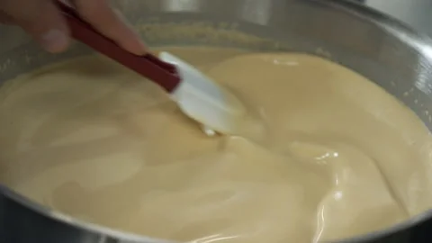 Chef stirring a pot with sauce Stock Footage 163317630