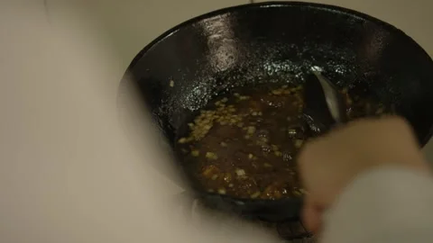 Chef Stirring Sauce with Vegetables in Wok on Stovetop in Beijing Street Food Stock Footage 345885316