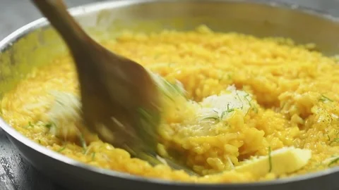 The chef stirs the freshly prepared pumpkin risotto. Stock Footage 207018465